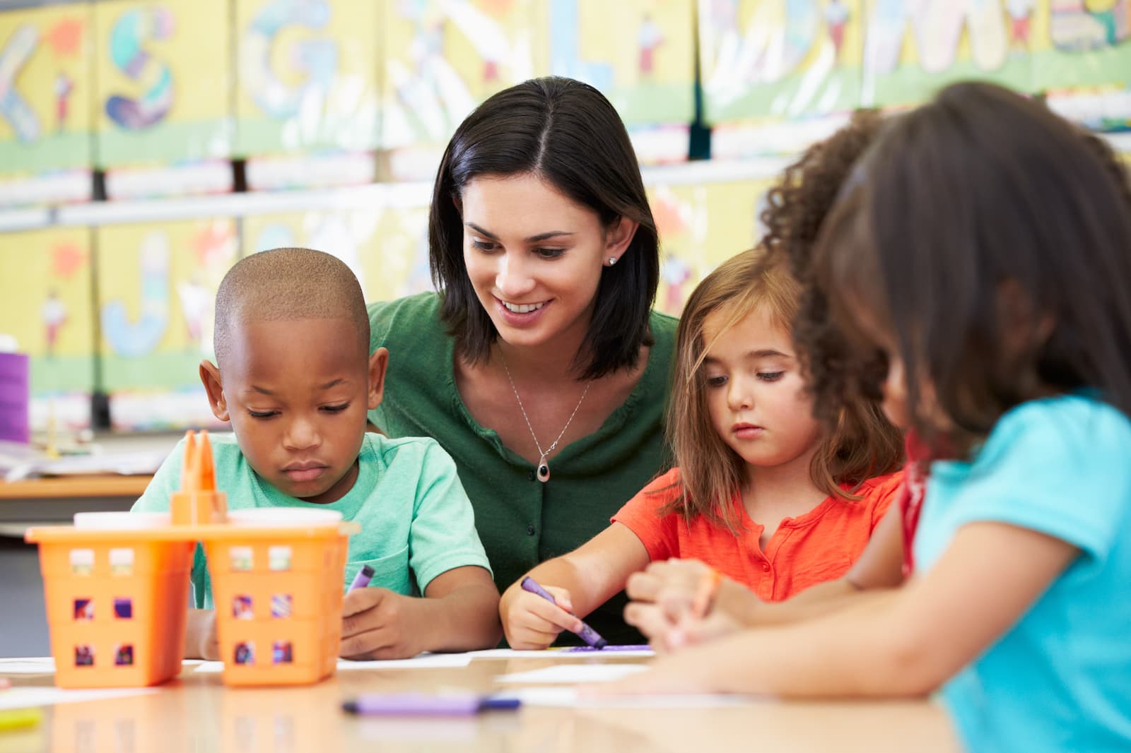 Children colouring in a classroom